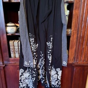 Biya.  Johnny was Black and Gray Embroidered cardigan